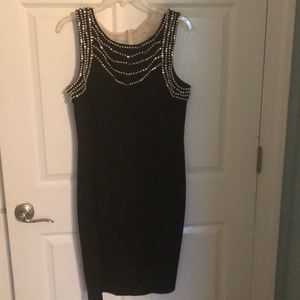 A black formal dress with pearl and rhinestones
